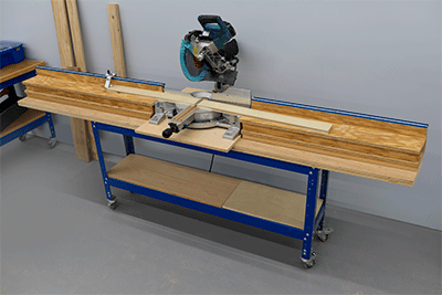 A miter saw station set up with support wings for long boards