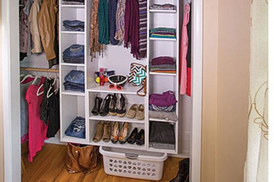 Modular closet organizer with clothes in closet