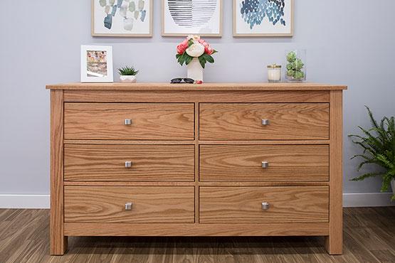 classic wood dresser with drawers in a bedroom