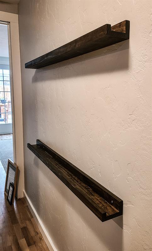 dark-wood-ledge-shelving-in-hallway